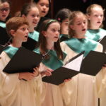 Catholic children choir singing at mass service
