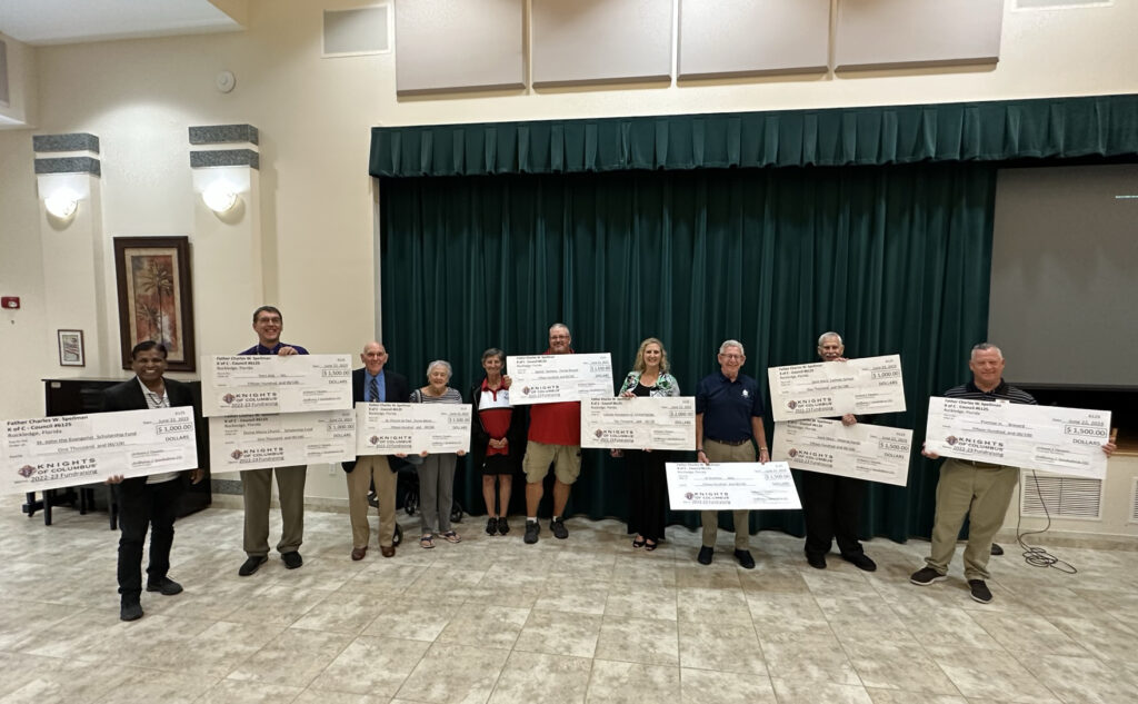 Knights of Columbus Donation checks wtih Madelyn Weed of CFOCF